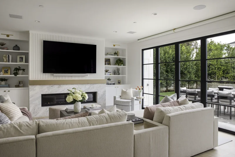 Full remodel family room with fireplace and floor-to-ceiling windows in Newport Beach — 28 Cape Andover
