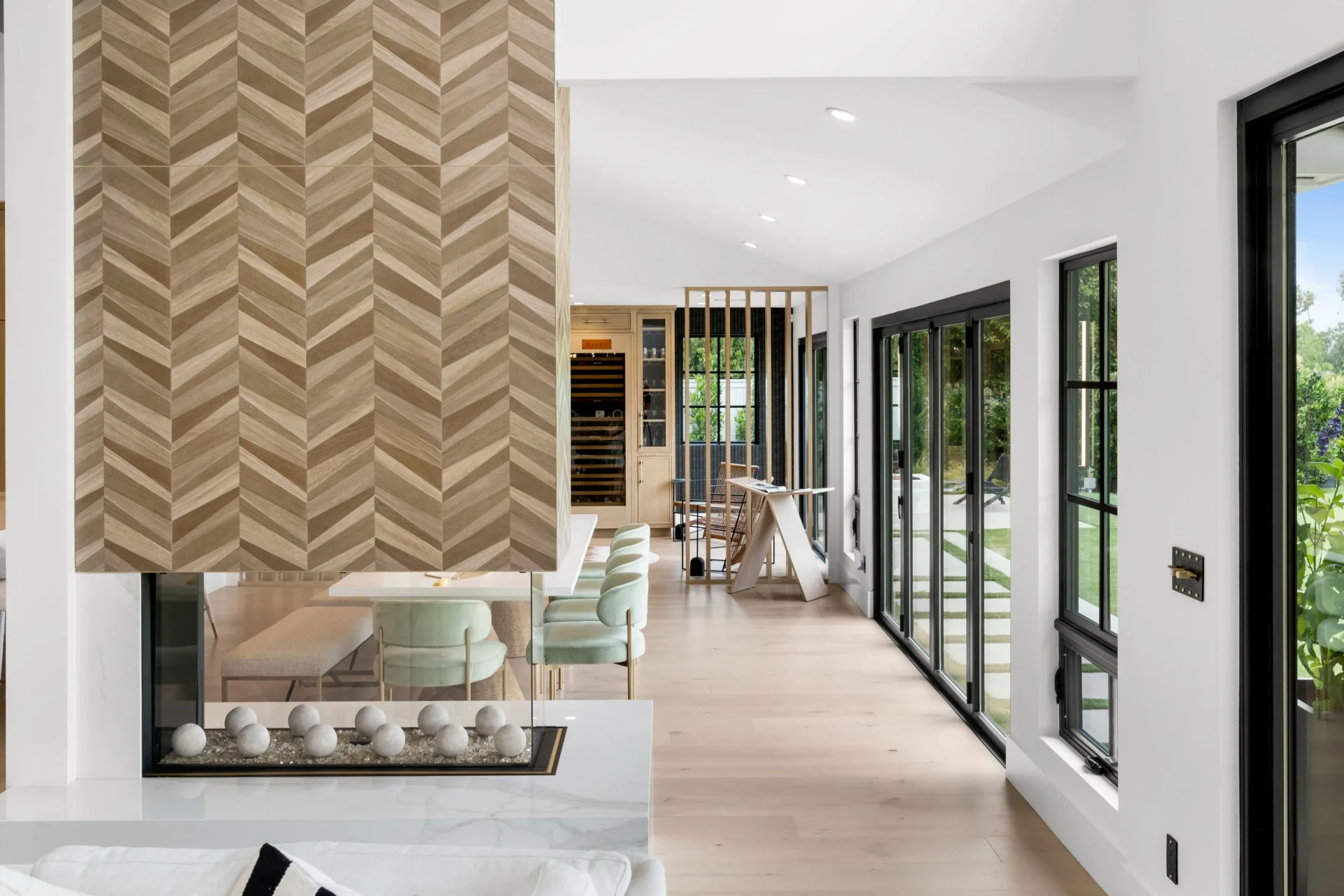 Open concept luxury kitchen with marble waterfall island in Costa Mesa