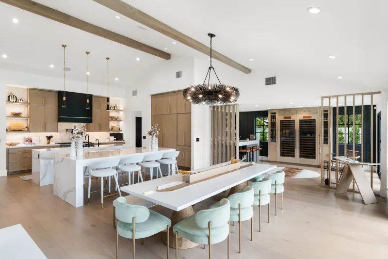 Open concept luxury kitchen with marble waterfall island in Costa Mesa